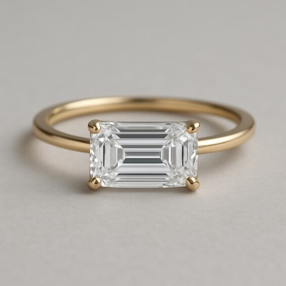 East-West mounted emerald cut ring